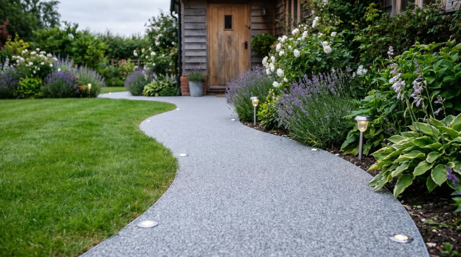 Illustrated silver-grey path with low edge lights and planted borders